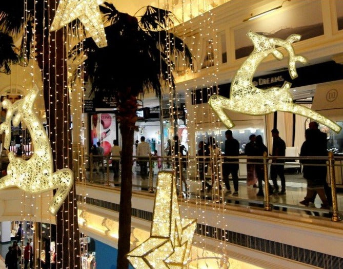 Shopping Mall Holiday Decor with Illuminated Reindeer, Stars and Curtain Lighting