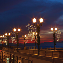 8' Falling Stars LED pole mount with sturdy metal frame and 110 warm-white C7 bulbs for outdoor lamppost displays