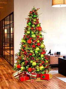 Holly Leaf pre-decorated holiday tree with apple green and warm red ornaments and red and green berry accents