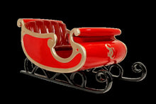 Santa's Sleigh display prop, fiberglass sleigh painted red with gold and green accents, 81" L x 39" W x 39" H, seats two adults, 400 lb, indoor/outdoor