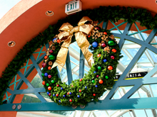 Jewel Tone Commercial Wreath , pre-decorated outdoor wreath with Mountain Pine foliage, gold bow and warm white LED lights