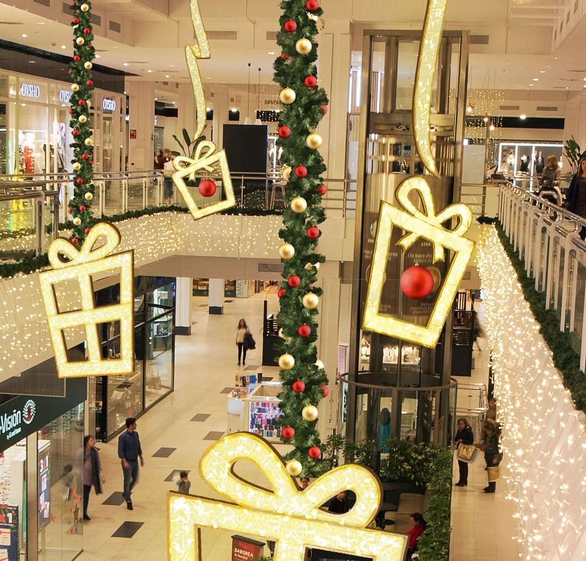 Warm-white LED mini lights woven through clear silicone netting form a 4.4' x 3.5' 2D gift box silhouette, 119 lights, outdoor use