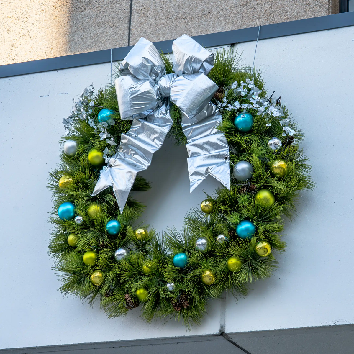 Outdoor decorative bow for large wreaths, garland, trees, facades, entrances, and municipal or retail displays