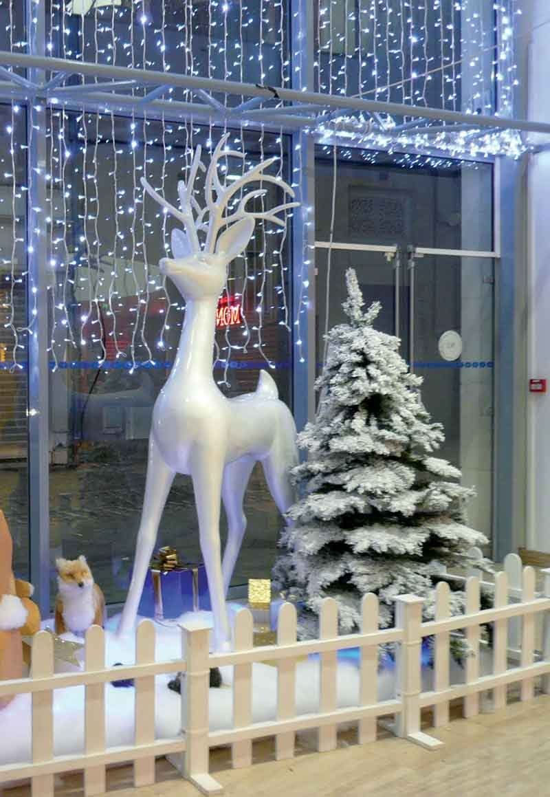 Fiberglass standing reindeer with ornate antlers, 45 lb, suited for storefronts, hotel entrances and municipal displays