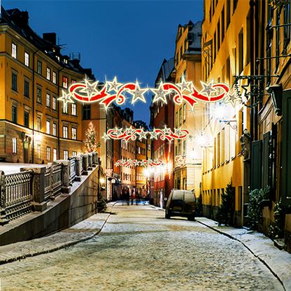 Star Swirl with Ribbon overhead décor, red ribbon and red plus warm-white LEDs for commercial overheads